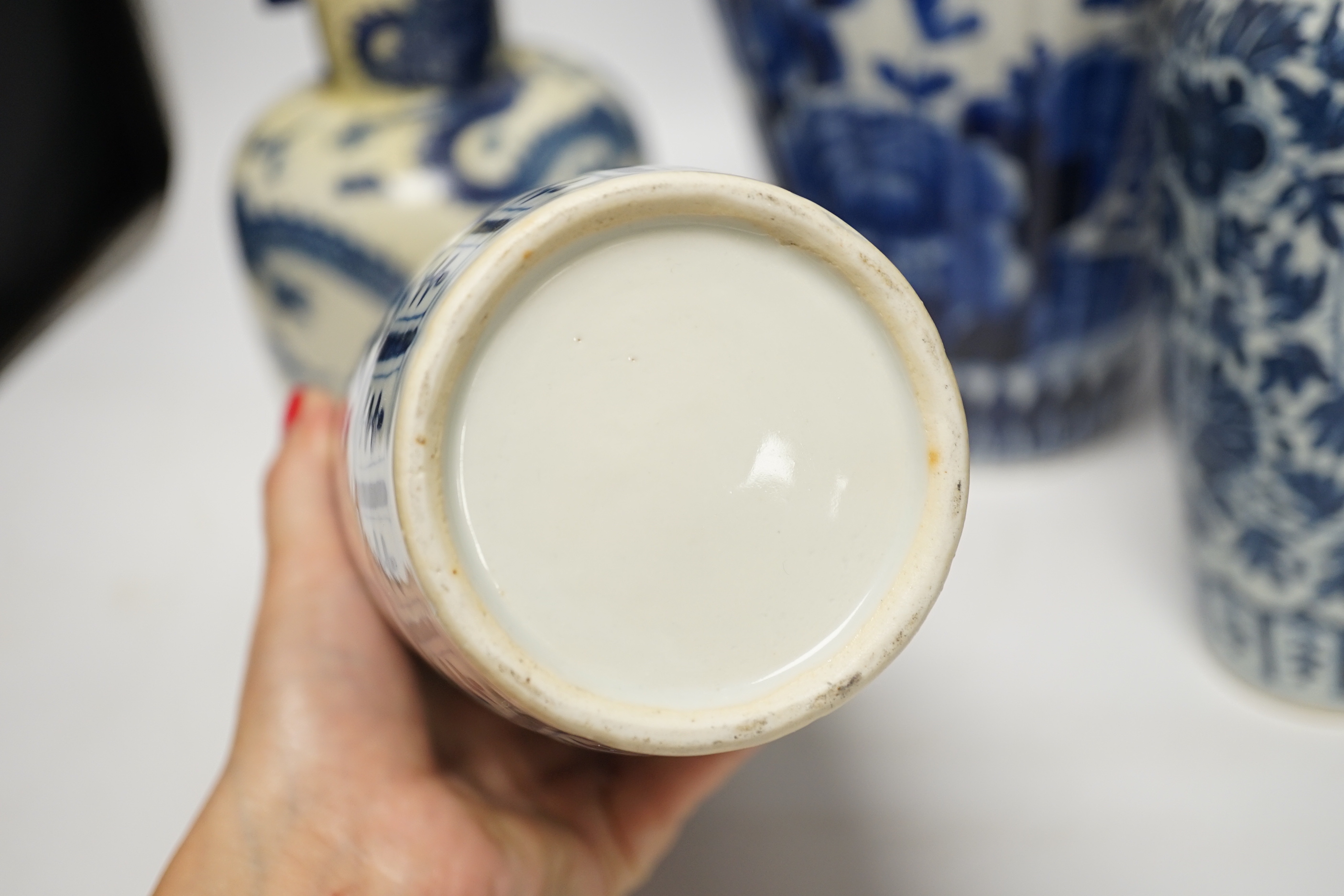 Three 19th century Chinese blue and white vases including a floral pair and a Japanese vase, largest 39cm high